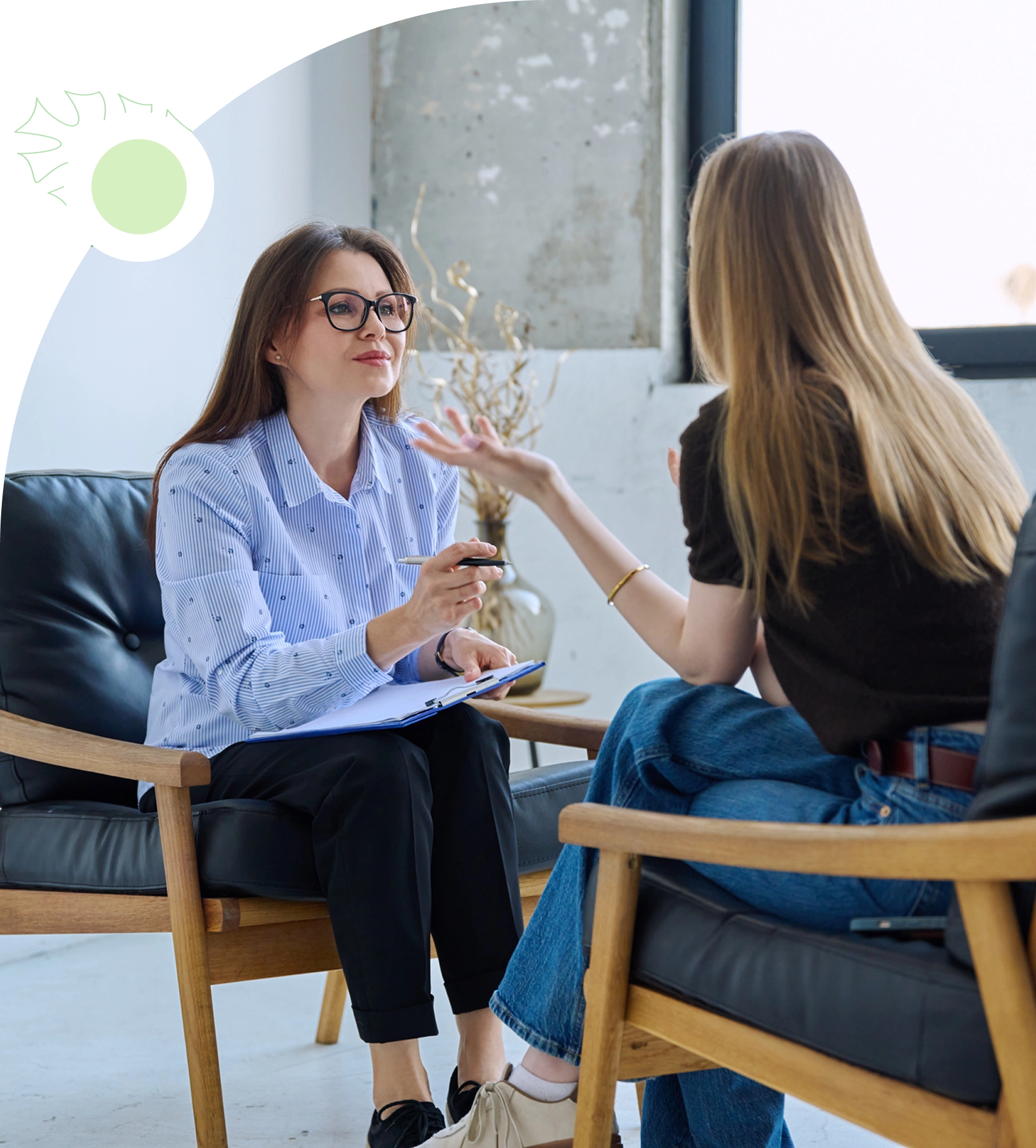 Two women having a conversation indoors.